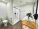 Contemporary bathroom showcasing a tiled shower, sleek fixtures, and minimalist design at 14 Fir Trail Way, Ocala, FL 34472
