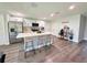 Spacious kitchen with island, stainless steel appliances, and stylish breakfast bar stools at 14 Fir Trail Way, Ocala, FL 34472