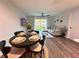 Open floor plan featuring a dining area and living room with modern furniture and decor at 14 Fir Trail Way, Ocala, FL 34472