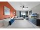 Bright bedroom featuring two queen beds, colorful accent wall and sliding glass door to the screened lanai at 14200 Avalon Rd # 409, Winter Garden, FL 34787