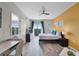 Inviting bedroom featuring a balcony, contemporary decor, and a well-lit space for relaxation and comfort at 14200 Avalon Rd # 409, Winter Garden, FL 34787