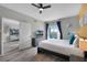 Well-appointed bedroom with balcony access, a sleek design, and ample natural light for a tranquil atmosphere at 14200 Avalon Rd # 409, Winter Garden, FL 34787