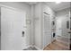 Neat hallway with in-unit washer and dryer hookups, ample closet space, and a tidy entrance area at 14200 Avalon Rd # 409, Winter Garden, FL 34787