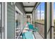 Large screened in lanai with beautiful green view, comfortable seating and ceiling fan at 14200 Avalon Rd # 409, Winter Garden, FL 34787
