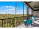 Screened lanai with scenic views, comfortable seating, and shaded space for outdoor enjoyment at 14200 Avalon Rd # 409, Winter Garden, FL 34787