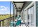 Expansive screened lanai with lush views, comfortable seating, and stylish ceiling fan at 14200 Avalon Rd # 409, Winter Garden, FL 34787