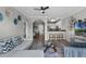 Bright and airy living room featuring modern decor, wood floors and an open concept design leading to the kitchen at 14200 Avalon Rd # 409, Winter Garden, FL 34787