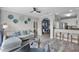 Bright living room with modern decor, comfortable seating, and an open floor plan flowing into the kitchen and dining area at 14200 Avalon Rd # 409, Winter Garden, FL 34787