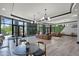 Relaxing lobby area features comfortable seating, modern lighting fixtures, and stylish interior design at 14200 Avalon Rd # 409, Winter Garden, FL 34787