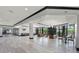 Spacious lobby includes hardwood floors, plenty of seating, and floor-to-ceiling windows at 14200 Avalon Rd # 409, Winter Garden, FL 34787