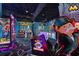 Interior view of a playful game room with a variety of arcade and amusement machines at 14501 Grove Resort Ave # 3636, Winter Garden, FL 34787