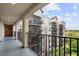 View from the balcony showcasing the building's architecture and green landscape at 14501 Grove Resort Ave # 3636, Winter Garden, FL 34787