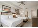 Bright bedroom featuring two beds, modern decor, and an open doorway to the bathroom at 14501 Grove Resort Ave # 3636, Winter Garden, FL 34787
