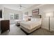 Bright bedroom with two beds, complemented by stylish decor and ample natural light for a relaxing atmosphere at 14501 Grove Resort Ave # 3636, Winter Garden, FL 34787