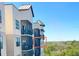 Exterior view of building with screened balconies at 14501 Grove Resort Ave # 3636, Winter Garden, FL 34787