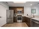 Well-equipped kitchen featuring stainless steel appliances and modern cabinetry, ideal for cooking and entertaining at 14501 Grove Resort Ave # 3636, Winter Garden, FL 34787