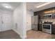 Modern kitchen featuring stainless steel appliances and sleek cabinets, perfect for culinary enthusiasts at 14501 Grove Resort Ave # 3636, Winter Garden, FL 34787