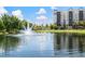 Scenic view of the lake with a fountain and buildings in the background at 14501 Grove Resort Ave # 3636, Winter Garden, FL 34787