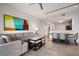 Inviting living room with a view into the kitchen and dining area, with an expansive couch at 14501 Grove Resort Ave # 3636, Winter Garden, FL 34787