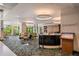 Inviting hotel lobby with contemporary decor, featuring ample seating, a reception desk, and views of lush landscaping at 14501 Grove Resort Ave # 3636, Winter Garden, FL 34787