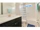 Clean bathroom featuring modern fixtures, a shower with a patterned curtain, and tile flooring at 16410 Good Hearth Blvd, Clermont, FL 34711