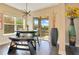 Cozy breakfast nook with modern lighting, wood floors, and a sliding glass door to the patio at 16410 Good Hearth Blvd, Clermont, FL 34711