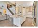 Elegant kitchen featuring an island, stainless appliances, and an open layout that connects to the living and dining areas at 16410 Good Hearth Blvd, Clermont, FL 34711