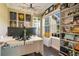 Inviting office with large window, dark wood floors, and organized shelving and modern decor at 16410 Good Hearth Blvd, Clermont, FL 34711