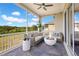 Outdoor screened patio with comfortable seating and a modern fire pit, perfect for relaxing and entertaining at 16410 Good Hearth Blvd, Clermont, FL 34711