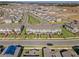 Aerial view of a well-planned neighborhood with manicured lawns and coordinated color schemes at 17081 Water Spring Blvd, Winter Garden, FL 34787