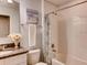 Clean bathroom featuring a shower-tub combo, floral shower curtain and a granite topped vanity at 17081 Water Spring Blvd, Winter Garden, FL 34787