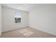 Cozy bedroom with neutral carpet and a window bringing in natural light at 17081 Water Spring Blvd, Winter Garden, FL 34787