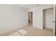 Bedroom featuring a closet, neutral carpet, and an adjacent bathroom with an open doorway at 17081 Water Spring Blvd, Winter Garden, FL 34787