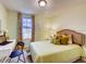Bedroom features a work station, large window, and comfortable decor at 17081 Water Spring Blvd, Winter Garden, FL 34787