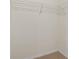 White closet with neutral carpet and wire shelving at 17081 Water Spring Blvd, Winter Garden, FL 34787