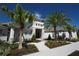 Inviting clubhouse entrance with lush landscaping and stone accents, welcoming residents and guests at 17081 Water Spring Blvd, Winter Garden, FL 34787