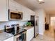 Efficient kitchen featuring stainless steel appliances and granite countertops at 17081 Water Spring Blvd, Winter Garden, FL 34787