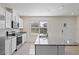 Bright kitchen features stainless steel appliances, granite countertops, and island with sink at 17081 Water Spring Blvd, Winter Garden, FL 34787