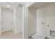 Bright laundry room with neutral colors, white washer connections, and closed folding doors at 17081 Water Spring Blvd, Winter Garden, FL 34787