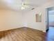 This bedroom features a mirror, neutral walls, and laminate flooring throughout at 186 Tulpan Dr, Kissimmee, FL 34743