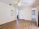 This bedroom features a closet, neutral walls, and laminate flooring throughout at 186 Tulpan Dr, Kissimmee, FL 34743