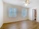 This bedroom features natural light, neutral walls, and laminate flooring throughout at 186 Tulpan Dr, Kissimmee, FL 34743
