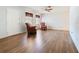 Inviting living room with light-colored walls, wood-look floors, a ceiling fan, and ample space for seating at 186 Tulpan Dr, Kissimmee, FL 34743