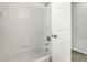 Clean bathroom featuring white tiling in the shower and a standard bathtub at 19540 Glen Elm Way, Orlando, FL 32833