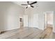 Spacious bedroom with light wood flooring, multiple entry doors, and plenty of natural light at 19540 Glen Elm Way, Orlando, FL 32833
