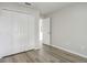 Bright bedroom with wood-look flooring, closet, and a neutral color palette at 19540 Glen Elm Way, Orlando, FL 32833
