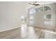 Bedroom with laminate flooring, sliding glass door, and large windows throughout the house at 19540 Glen Elm Way, Orlando, FL 32833