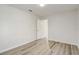 Bright bedroom with wood-look flooring, natural light, and neutral color scheme at 19540 Glen Elm Way, Orlando, FL 32833