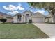 Charming single-Gathering home boasts a well-manicured lawn and two-car garage in a tranquil neighborhood at 19540 Glen Elm Way, Orlando, FL 32833