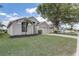 Single-Gathering home showcasing a well-kept lawn, mulch beds, and a spacious driveway leading to a garage at 19540 Glen Elm Way, Orlando, FL 32833